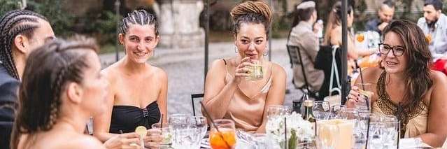 group of women talking while drinking