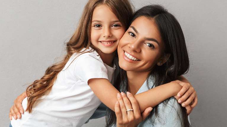 mother and her daughter with beautiful smile